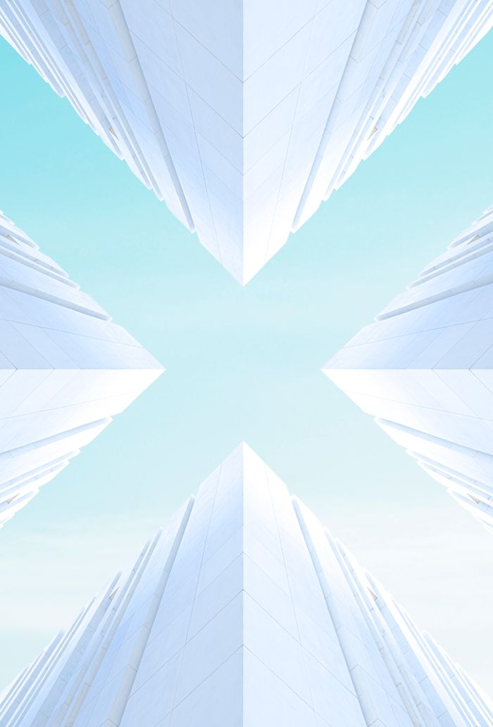 Stunning upward view of modern architecture in Rabat, Morocco, showcasing symmetry and minimalism.